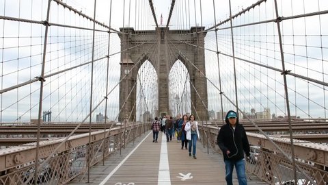NEW YORK, USA - September 26, 2018: Brooklyn Bridge view. Tourists walking on bridge. New York City, USA. Brooklyn Bridge is linking Lower Manhattan to Brooklyn. HQ Footage.