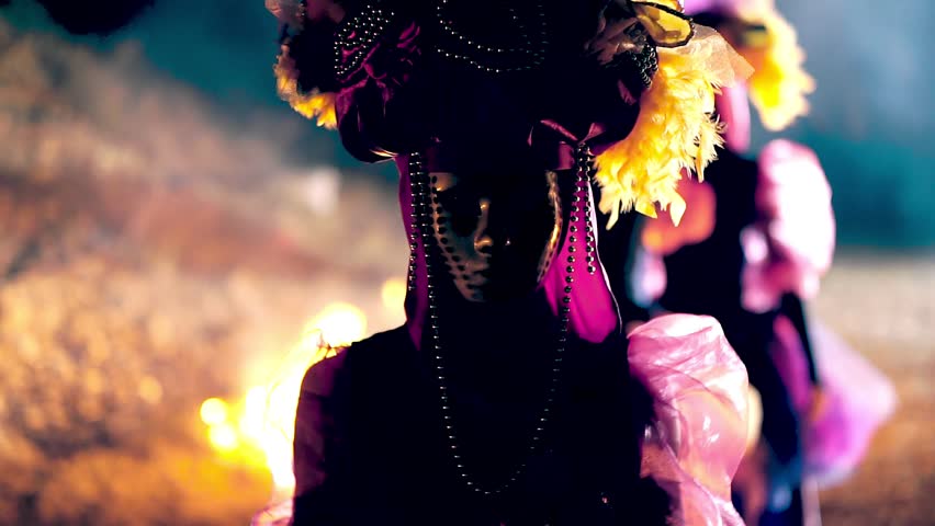 The face of the girl at the masquerade in a Venetian suit hides a mysterious mask. Dance with fire in the night. Concept idea for dance | Shutterstock HD Video #1020080023