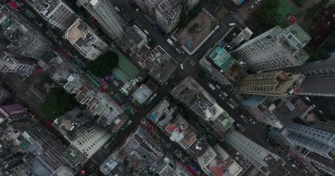 Hong Kong Circa-2017, establishing shot. A descending overhead aerial view of the cityscape.