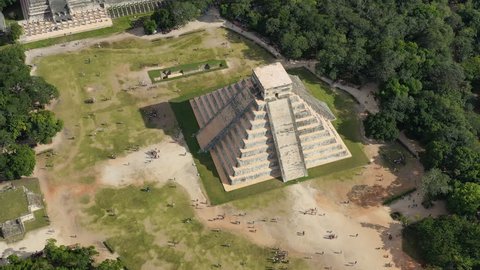 Aerial view of ancient Mayan city of Chichen Itza, famous mesoamerican pyramid El Castillo (Temple of Kukulkan) - landscape panorama of Yucatan Peninsula from above, Mexico, North America, 4k UHD