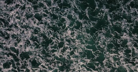 Aerial view beautiful of sea waves from drone. Stock footage of blue color ocean water, wave, sea surface. Top view on turquoise waves, clear water surface texture. Top view, amazing nature background