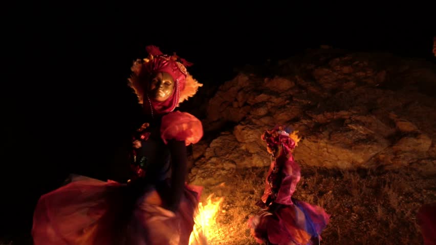 girls in a Venetian masquerade costume dancing in the open air. on the faces of people of the mask without emotion. Royalty-Free Stock Footage #1020089920