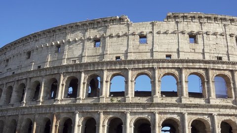 Famous Italian attraction Colosseum in Rome. View on ancient Flavius amphitheater Coliseum in capital of Italy. Camera moving from right to left