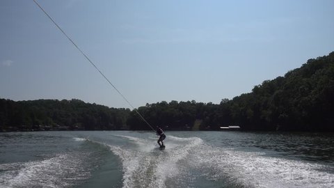 Wakeboarding in the morning on the lake.