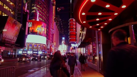 NEW YORK CITY, USA - OCT 30, 2018: Fastforward walk in Times Square at night in midtown Manhattan New York City.