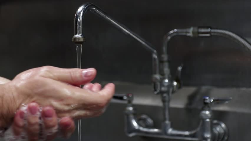 Man's hands washing up with soap in industrial sink. Royalty-Free Stock Footage #1020113917
