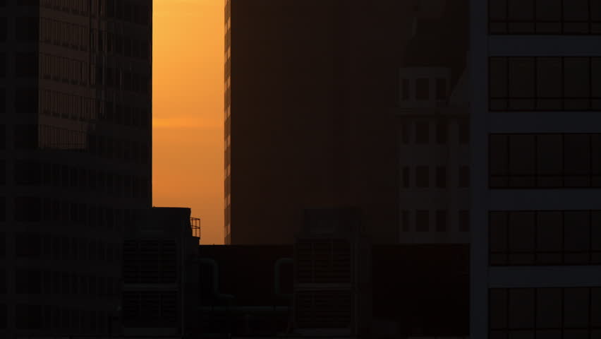 Telephoto Sunset Between Buildings Timelapse 4k