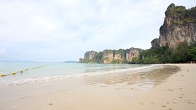  Tropical white sand beach with calm sea, clear sky Railay, Krabi, Thailand 