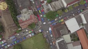 Top down view on intersection with little, colourful stalls on the streets, Chiang Mai, Thailand, 4K, D-Log