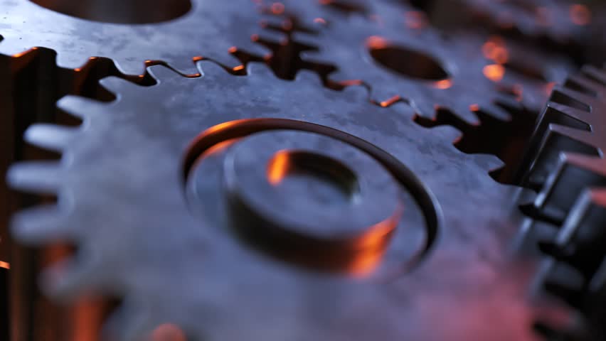 Closeup on slowly rotating dark metallic gears. Iron clockwork machinery in motion. Industrial metallic construction. Symbol of teamwork. perfect for industry or business related purposes.
 | Shutterstock HD Video #1020127852