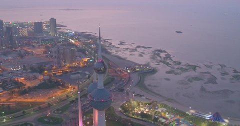 Drone aerial above Kuwait City panning around the iconic Kuwait Tower at night light, 4K Aerial View of a landmark of Kuwait City, Kuwait