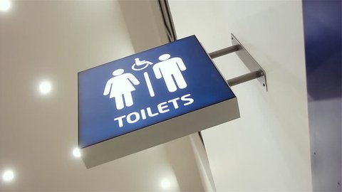 Toilets Sign at Prague Airport, Czech Republic. Close Up. Zoom In.