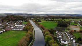 Aerial flyover shot of Caledonian Canal in Inverness, Scotland, UK