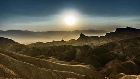 4k Timelapse movie film clip of Sunset at the heavily eroded ridges of the famous Zabriskie Point, Death Valley National Park, California, USA