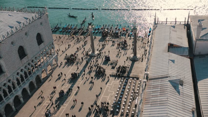 Italy, Venice. People walking on the quay