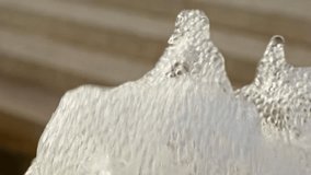 Foamy water of fountain in close-up slow motion
