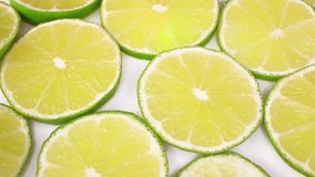 Green lemon lime fruit slices looping texture pattern closeup video