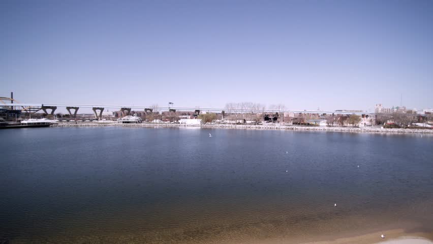 Fly over aerial view of lakeshore state park inlet lake near summerfest grounds.