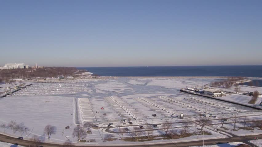 Aerial view of snow covered Mckinely marina south docks Milwaukee.