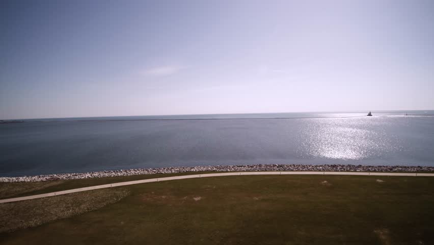 Aerial View of early morning sun shinning on Lake Michigan from Oak leaf trail park.