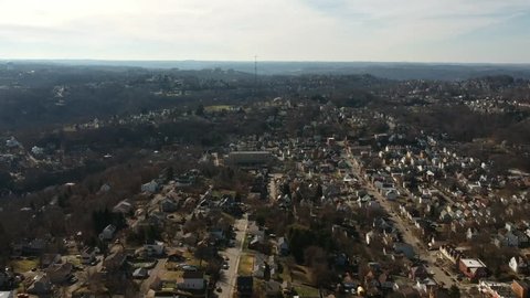 Drone shot of city on a hill