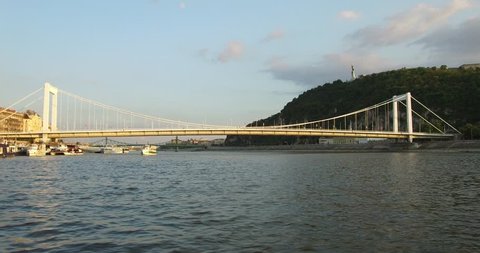 View of the Elisabeth Bridge over the Danube in sunset from the Danube in Budapest.