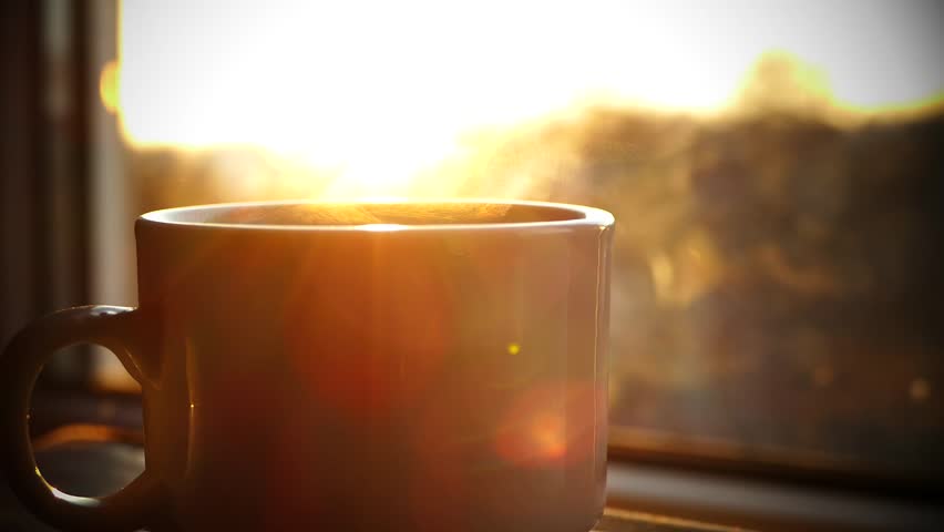 A cup of hot tea by the window at sunset. Pouring boiling water and steaming tea or coffee at dawn. Drink your morning drink. | Shutterstock HD Video #1020208144