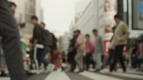 Slowmotion - People walking in the scrambled intersection in Shibuya