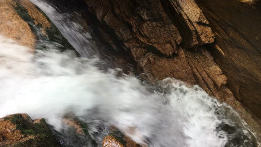 water flowing around rocks at the Flume Gorge in Franconia Notch State Park, New Hampshire