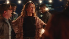 happy group of friends dancing together enjoying rooftop party music at night having fun drinking alcohol celebrating weekend reunion gathering - Powered by Shutterstock - Get 15% off with code: PIKWIZARD15