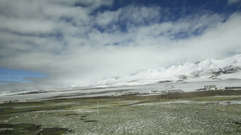 View through window of Qinghai–Tibet railway between Xining, Qinghai Province and Lhasa, Tibet Autonomous Region. The line leads up to 5.072 m (Tanggula Pass) and is the the world highest railway.