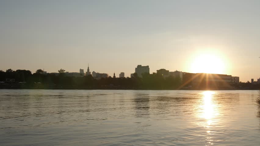 Beautiful city sunset timelapse, over river in Warsaw, Poland.