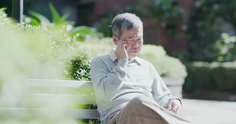 old man depressed and forget something outdoor