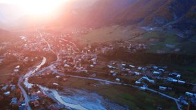 Early sunset behind the mountains over Mestia. a remote village in the mountains of the Georgian Republic. UltraHD 4k footage