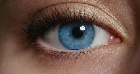 close up macro blue eye opening human iris natural beauty 4k footage shot on Red Epic Dragon