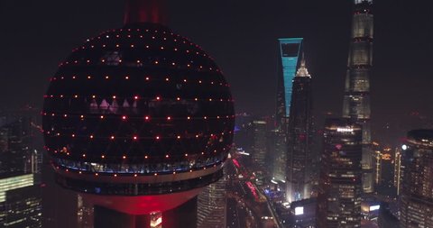 Shanghai China Circa-2017, aerial view of the cityscape at night. Oriental Pearl tower close up.