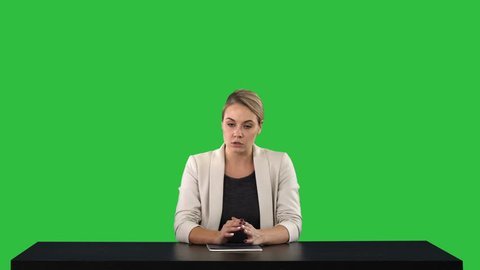 A female newsreader presenting the news, add your own text or image screen behind her on a Green Screen, Chroma Key.