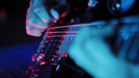 Close up on hands playing on electric guitar 4K