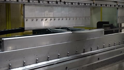CNC bending machine. The machine bends the metal part