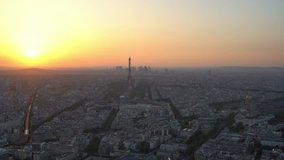 Aerial sunset footage of the famous Eiffel Tower and downtown citypscape at France