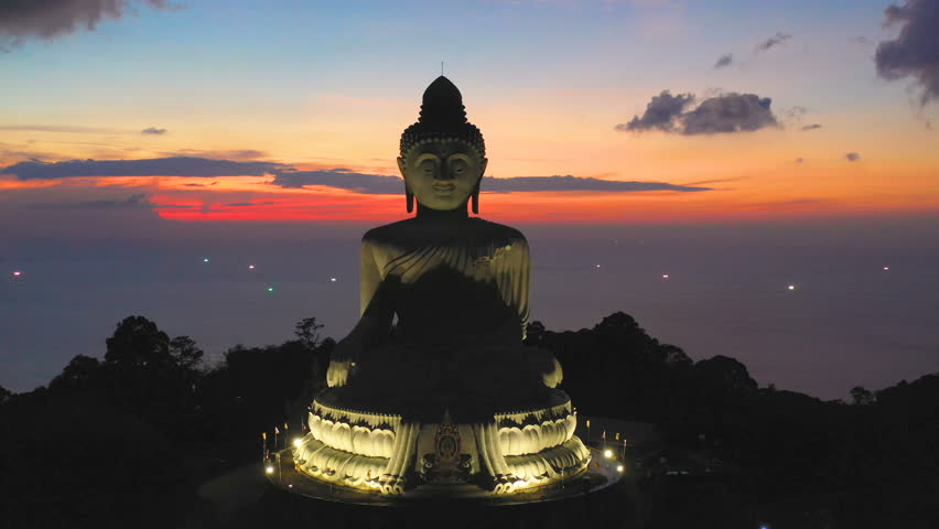 aerial view Phuket big Buddha in sunset.Phuket Big Buddha is one of the island most important and revered
landmark on Phuket island location is on the high mountain can see view around Phuket island Royalty-Free Stock Footage #1020327052