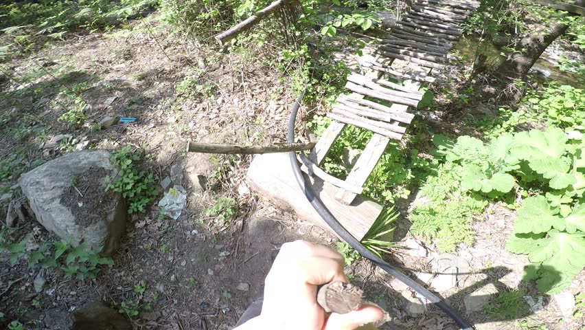 Someone crosses the old bridge in the forest and recording video by head camera. Armutlu Kemalpasa Aegean Izm?r Turkey