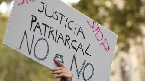 Poster with inscription in Spanish. Stop Patriarchal Justice. Feminist Activists in a Demonstration. March for the International Day of Nonviolence against Women and Children. No means No