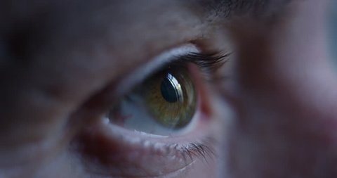 Close-up macro shot of middle age male human brown eye blinking in slow motion. Concept of moments of life, memory, eye care, optics., lens. Shot with RED 8K