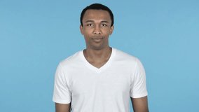 Online Video Chat by Young African Man on Smartwatch isolated on Blue Background
