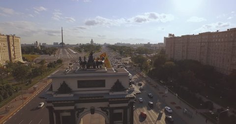 Aerial view of Triumphal arch on Kutuzovsky avenue with traffic at summer day in Moscow 4k