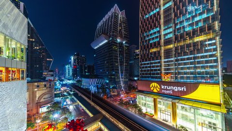 Thailand, Bangkok - December 2018: Time lapse Bangkok Downtown Skyline at Night.BTS Skytrain line and Skyscrapers. Bangkok Night Cityscape. Aerial Timelapse 4k. 