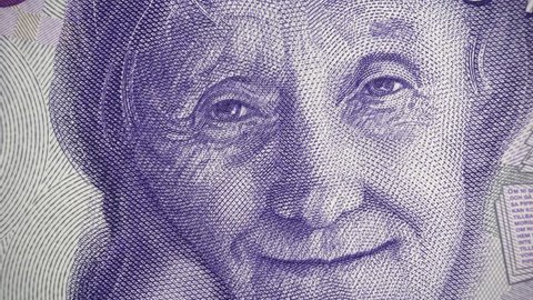 Astrid Lindgren portrait on Sweden 20 krona (2015) banknote rotating, Swedish money close up. 4K UHD video footage.