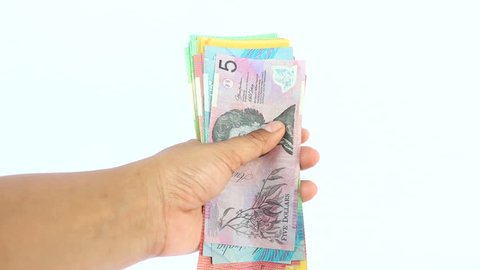 Hand of human holding many colorful AUD dollars cash and counting