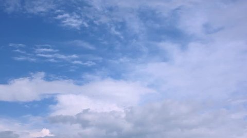 White rolling, building clouds time lapse, nature blue soft clear sky in summer sunny day, real beautiful colors in horizon, big fluffy, puffy cloudscape fast moving away.